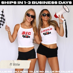 May include: Two women wearing white tank tops with the words "BIG" and "LITTLE" in red, along with a race car graphic. They are also wearing black shorts. One holds a checkered flag, the other a megaphone. The text "f1 little" is at the bottom.