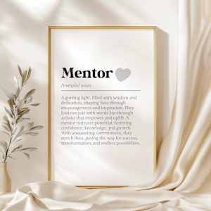 May include: A black and white printable art print with the word "Mentor" in bold, followed by a definition of the word. The definition is in a smaller font size and includes the phrase "a guiding light, filled with wisdom and dedication". A gray heart is to the right of the word "Mentor".
