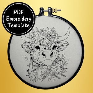 May include: Black and white line art embroidery design of a Highland cow with a floral crown and a bow. The design is on a white background and is perfect for embroidery projects.