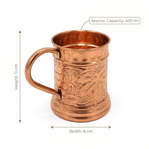 May include: A copper mug with a curved handle, featuring an embossed grape and leaf pattern on the exterior. The mug has a height of 11 cm, a width of 8 cm, and an approximate capacity of 400 ml as indicated by the text labels in the image.