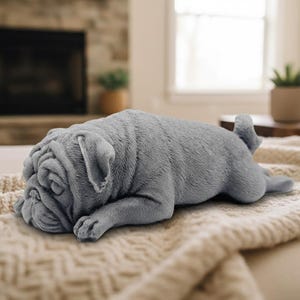 Handmade vegan soap featuring sleepy pug lying down and packed in beautiful eco friendly packaging. crafted with natural French clays, activated charcoal and essential oils. a eco-friendly, zero waste gift that’s cruelty-free, skin-nourishing, and perfect for pug owners, dog lovers or animal themed gifts. Small business UK