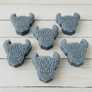 Handmade vegan soaps featuring a set of six mini highland cow soaps gift boxed in beautiful eco friendly packaging.