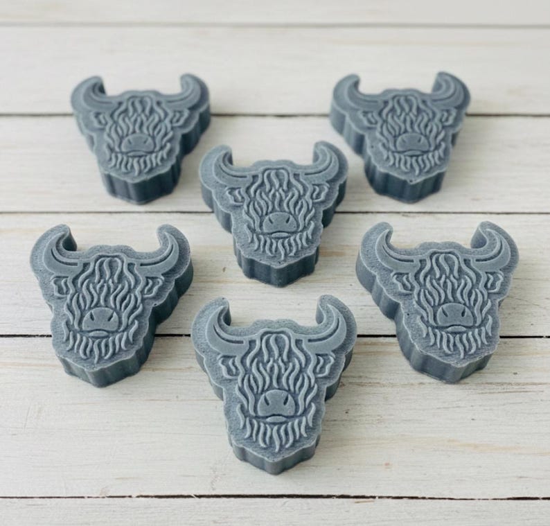 Handmade vegan soaps featuring a set of six mini highland cow soaps gift boxed in beautiful eco friendly packaging.