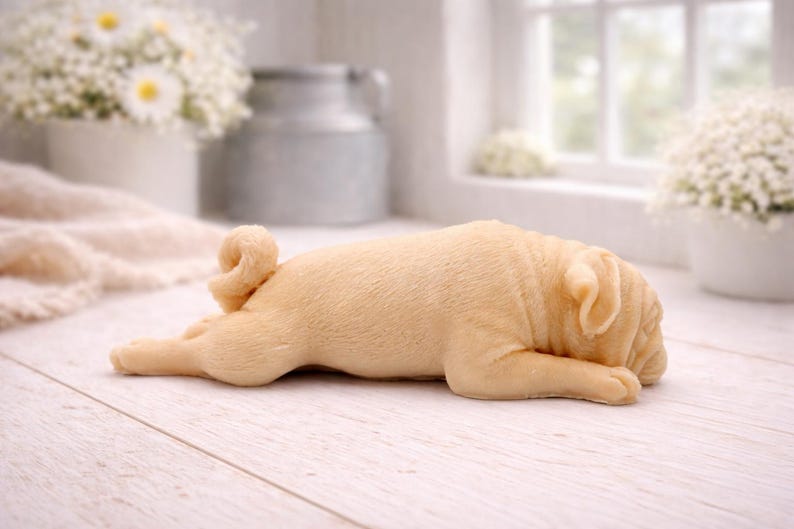Handmade vegan soap featuring sleepy pug lying down and packed in beautiful eco friendly packaging. crafted with natural French clays, activated charcoal and essential oils. a eco-friendly, zero waste gift that’s cruelty-free, skin-nourishing, and perfect for pug owners, dog lovers or animal themed gifts. Small business UK