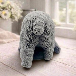 huge highly detailed polar bear shaped vegan bar soap, handmade and resting on a rustic wooden table with floral backdrop - ideal sustainable gift idea for animal lovers.