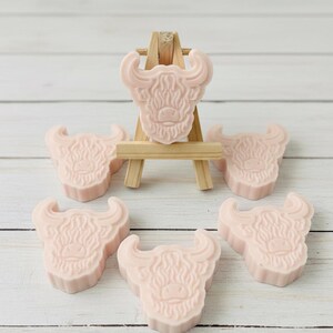 Handmade vegan soaps featuring a set of six mini highland cow soaps gift boxed in beautiful eco friendly packaging.