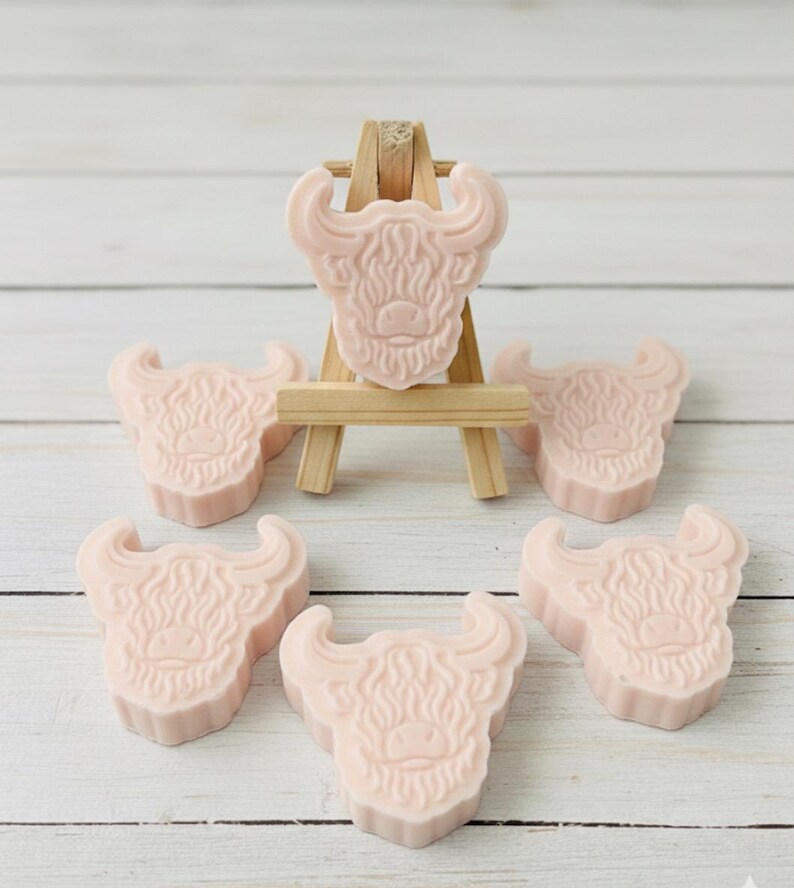 Handmade vegan soaps featuring a set of six mini highland cow soaps gift boxed in beautiful eco friendly packaging.