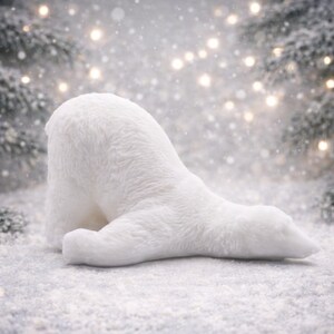 huge highly detailed polar bear shaped vegan bar soap, handmade and resting on a rustic wooden table with floral backdrop - ideal sustainable gift idea for animal lovers.