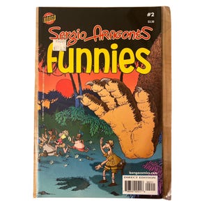 May include: A comic book titled "Sergio Aragonés Funnies #2" with a colorful illustration of a giant claw reaching towards cartoon figures. The cover features a black background with yellow text and a Direct Edition label.