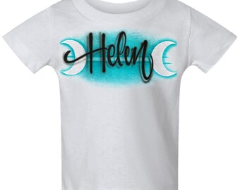 Diseño de nombre personalizado con lunas crecientes escritas con aerógrafo