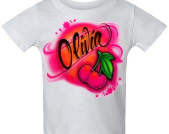 Diseño de nombre personalizado con cerezas en escritura con aerógrafo