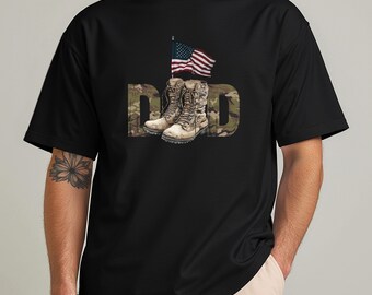May include: Black t-shirt featuring the word "DAD" in a camouflage pattern, with combat boots and an American flag graphic. The boots are worn and detailed, and the flag is waving. The shirt is a classic crew neck.