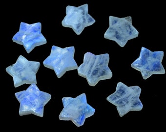 May include: Ten iridescent blue and white star-shaped moonstone crystals on a black background.