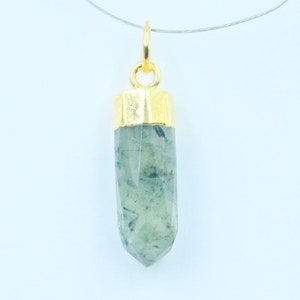 May include: A gold-capped green crystal pendant on a clear chain necklace.