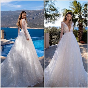 Sparkly lace wedding dress Deep V-neck bridal gown Long sleeve wedding dress Elegant A-line wedding dress Tulle skirt bridal dress ivory