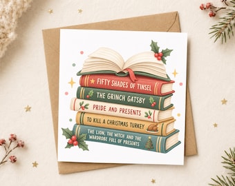 May include: A square greeting card featuring an illustration of a stack of five books topped with an open book. The spines are labelled Fifty Shades of Tinsel, The Grinch Gatsby, Pride and Presents, To Kill a Christmas Turkey, and The Lion, the Witch and the Wardrobe Full of Presents, decorated with holly and a small Christmas tree.