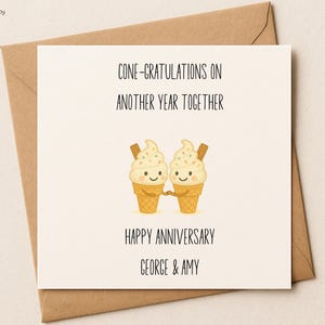 May include: A greeting card with a brown envelope. The card features two smiling ice cream cones with the text "CONE-GRATULATIONS ON ANOTHER YEAR TOGETHER" and "HAPPY ANNIVERSARY GEORGE & AMY".