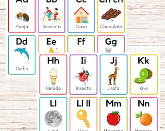 May include: A set of colourful flashcards featuring the Spanish alphabet. Each card shows a letter, a picture and the Spanish word for the picture. The letters are Aa, Bb, Cc, Ch ch, Dd, Ee, Ff, Gg, Hh, Ii, Jj, Kk, Ll, Ll II, Mm, and Nn. The pictures include a bee, bicycle, house, chocolate, dolphin, star, flower, cat, ice cream, ladybug, giraffe, kiwi, moon, key, apple, and orange.