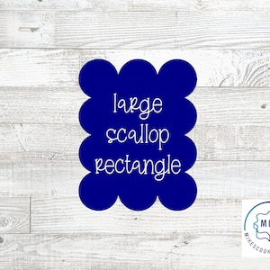May include: A dark blue, large scallop rectangle cookie cutter with the words "large scallop rectangle" in white script. The cutter is on a light wood grain background. The logo for Mike's Cookie Cutters is in the bottom right corner.