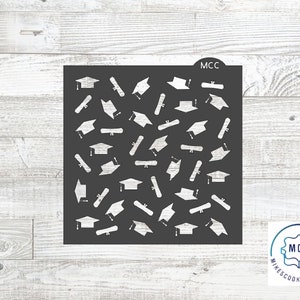 May include: A black stencil with a repeating pattern of graduation caps and diplomas. The stencil is labeled "MCC" in the top right corner.