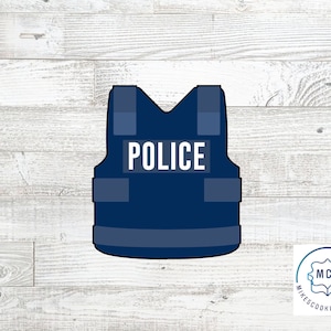 May include: Blue police vest cookie cutter with the word "POLICE" printed on the front.