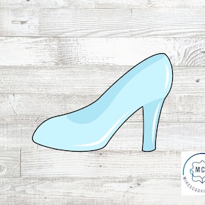 May include: A light blue glass slipper cookie cutter. The cutter is shaped like a high-heeled shoe with a pointed toe.