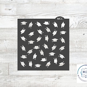 May include: Black stencil with a repeating pattern of graduation caps. The stencil is labeled "MCC" in the top right corner.