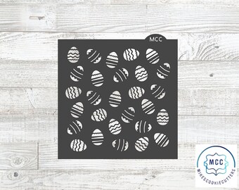 May include: Black stencil with a pattern of white outlined eggs. The stencil is labeled "MCC" in the top right corner.