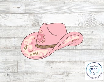 May include: Pink cowboy hat with a floral design. The hat has a brown band and a white brim.