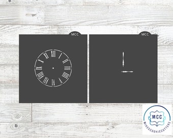 May include: Two cookie cutters, one shaped like a clock face with Roman numerals and the other shaped like clock hands. The cookie cutters are black and white and have the text "MCC" on them.