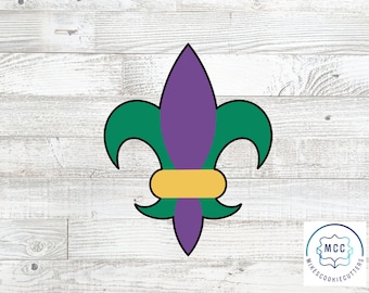 May include: A purple, green, and gold fleur-de-lis cookie cutter.  The cookie cutter is on a white wood background.  The text "MCC Mike's Cookie Cutters" is in a circle in the lower right corner of the image.
