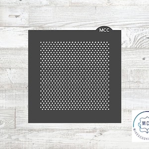 May include: A black and white cookie cutter with a repeating pattern of small circles. The cookie cutter is labeled "MCC" in the top right corner.