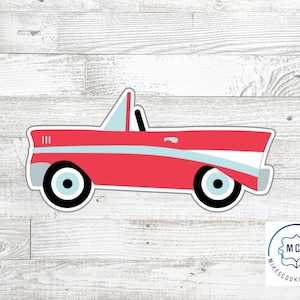 May include: A red convertible car cookie cutter with a light blue side stripe, a light blue windshield, and black and light blue wheels. The design features a classic vehicle silhouette with a white outline and a small logo in the corner.
