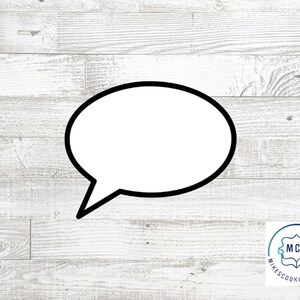 May include: A black and white outline of a speech bubble on a white wood background.