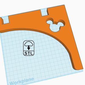 May include: Orange 3D printed wall shelf with a Mickey Mouse cutout. The shelf is designed to be mounted on a wall and has a curved shape. The STL file is available for download.