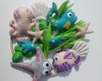 Móvil infantil con criaturas marinas, decoración de fieltro con temática oceánica para la habitación del bebé.