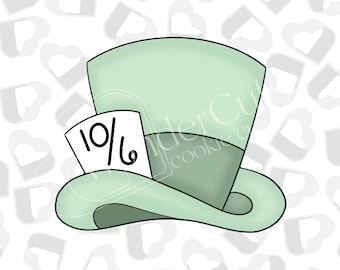 May include: A green and white hat with a black brim and a white card that says "10/6" on it.