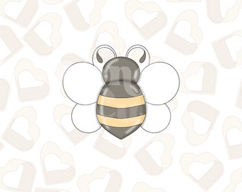 May include: A cartoon bee with a gray body and yellow stripes on its abdomen. The bee has white wings and is set against a background of white hearts.