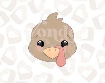 May include: A cartoon turkey head with brown feathers, big black eyes, a pink wattle, and a yellow beak. The turkey head is on a white background with a pattern of light brown hearts.
