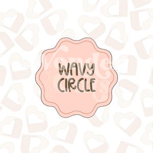 May include: A light pink, wavy-edged circle with the words "WAVY CIRCLE" in dark brown lettering. The background features a pattern of light pink heart shapes.