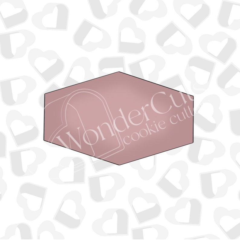 May include: A hexagonal cookie cutter with a pink, metallic finish. The cutter is shaped like a hexagon with rounded corners. The text "WonderCut cookie cutters" is printed on the cutter in white.
