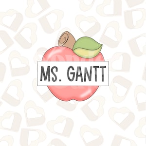 Puede incluir: Una manzana roja con una hoja verde y un tallo marrón. La manzana tiene una pancarta blanca en el medio que dice "MS. GANTT". El fondo es un patrón blanco de corazones.