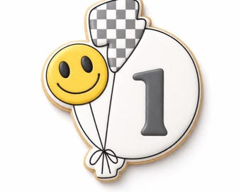 May include: A sugar cookie shaped like a large white balloon with the number 1 in gray, a smaller yellow smiley face balloon, and a gray and white checkered lightning bolt balloon, all tied together with black icing strings.