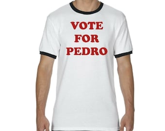 May include: White t-shirt with a black ringer neck and red text that reads "VOTE FOR PEDRO".