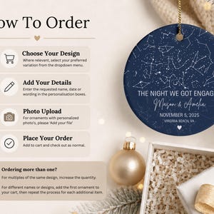 May include: A round navy blue ceramic ornament featuring a white star map constellation design. The text reads THE NIGHT WE GOT ENGAGED, Mason & Amelia, NOVEMBER 5, 2025, and VIRGINIA BEACH, VA. A gold chain is attached to the top of the ornament.