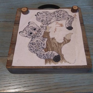 Completed cross stitch, snow leopards, snow, cats, wall hanging