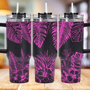 May include: Three stainless steel travel mugs with black lids and handles. The mugs feature a tropical leaf design with pink leaves on a black background.