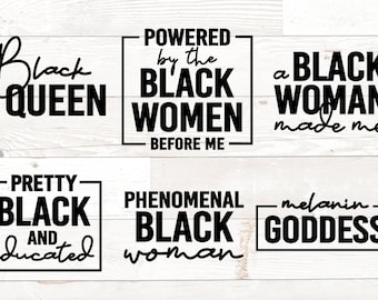 May include: Black and white text on a white wood background. The text reads: "Black Queen", "Powered by the Black Women Before Me", "A Black Woman Made Me", "Pretty Black and Educated", "Phenomenal Black Woman", and "Melanin Goddess".