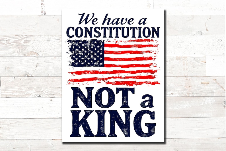 May include: A white rectangular sign with the text "We have a CONSTITUTION NOT a KING" in navy blue. The American flag is depicted in red and blue, with a distressed, brushstroke effect.
