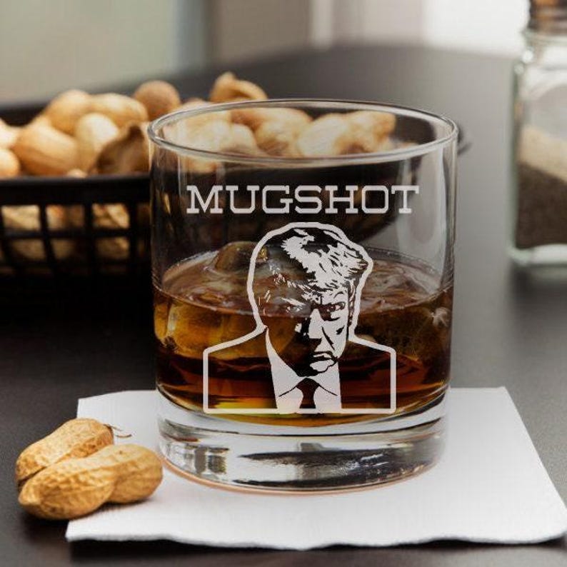 Trump Mug Shot Engraved Whiskey Glass, Funny Gift, Mugshot, Trump 2024, Mugshot Father Day, Patriotic, Republican Gift, at professional table photograph